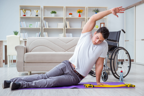 man exercising on floor of home