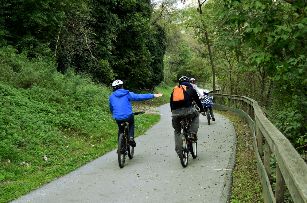 family taking a bike ride in the spring time