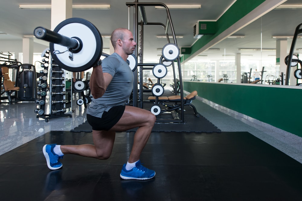 man with weights resistance training