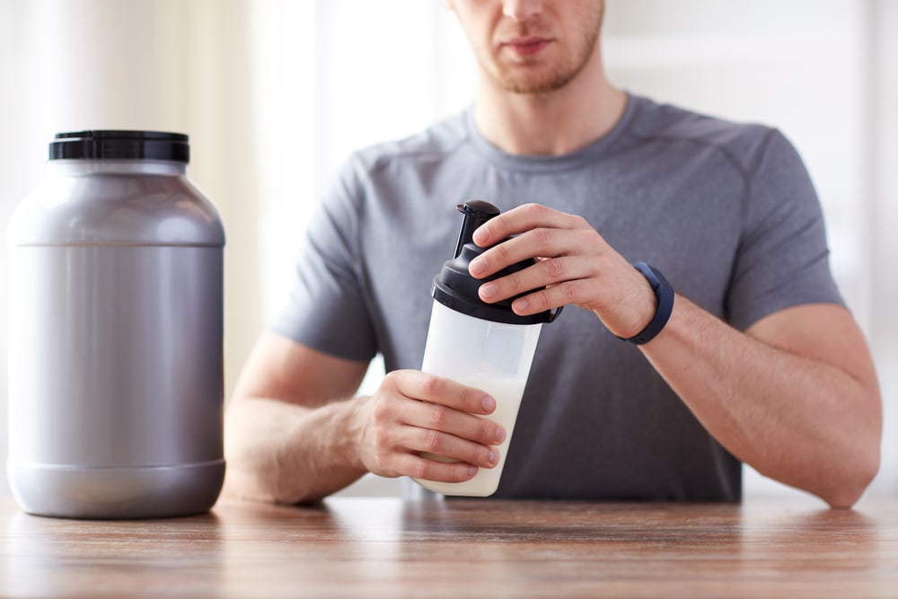 Man making Protein Shake before workout