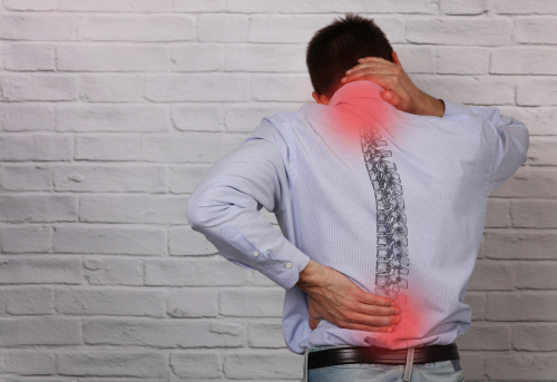 man with chronic lower back and neck pain