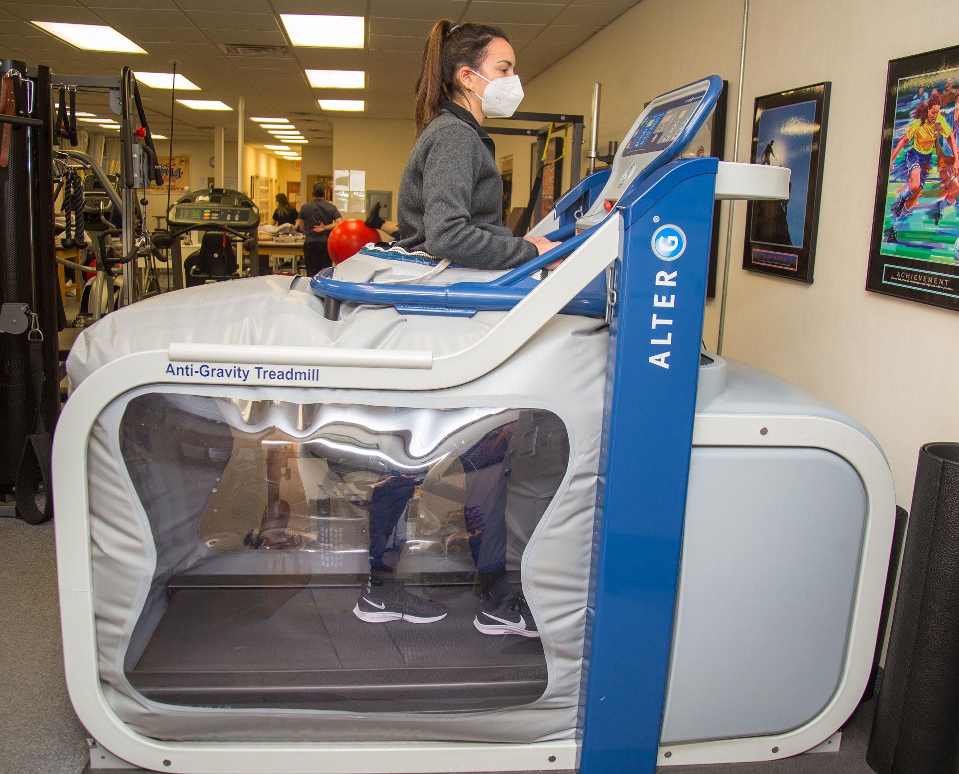 Patient using Alter G treadmill during treatment