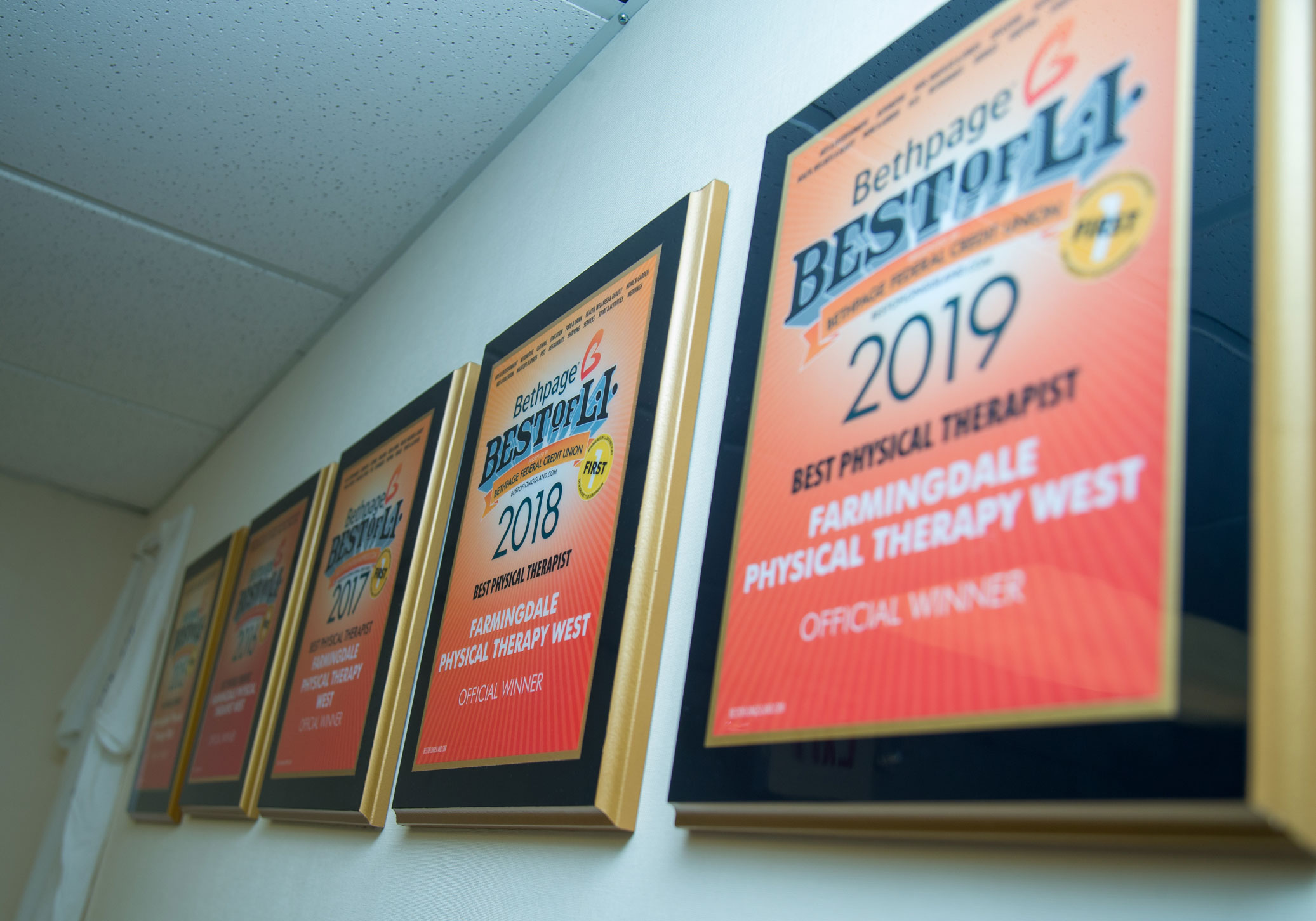 Best of Long Island certificates framed on the wall of our waiting room