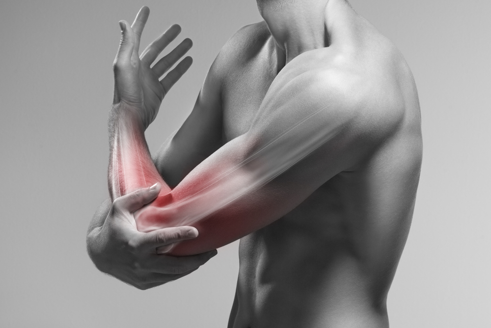 Man holds his elbow by the hand. Pain zone in the arm and bone illustration